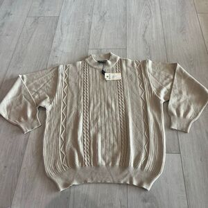 Tuscan beige cable knit sweater with a crew neck and various knit patterns size